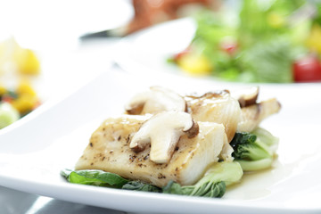 Fish meat with champignon mushroom
