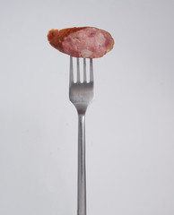 Sausage on a fork