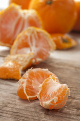 Fresh and juicy mandarin fruits on wooden table