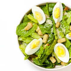 Caesar salad with eggs, lettuce, croutons and parmesan