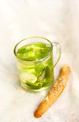 Mint tea with fresh mint leaves and biscuit