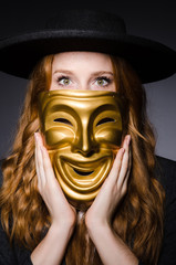 Woman with mask in hypocrisy concept