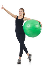 Young woman with ball exercising on whitee