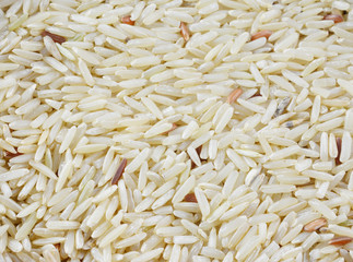 Boiled brown rice as a food background, top close-up view