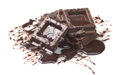 Closeup detail of chocolate parts on white background.