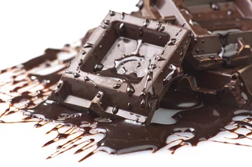 Foto auf Acrylglas Closeup detail of chocolate parts on white background. © Orlando Bellini