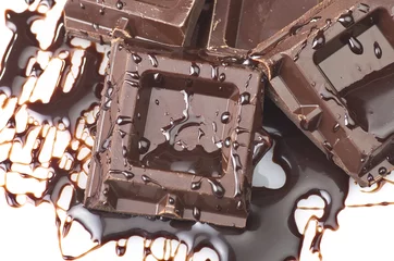 Foto auf Leinwand Closeup detail of chocolate parts on white background. © Orlando Bellini