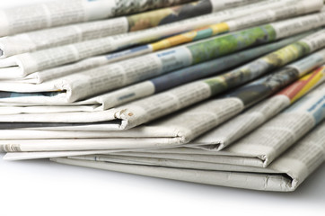 Pile of Various newspapers over white background. - 58439321