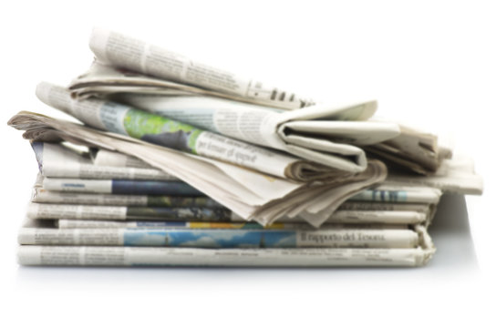 Pile of Various newspapers over white background.