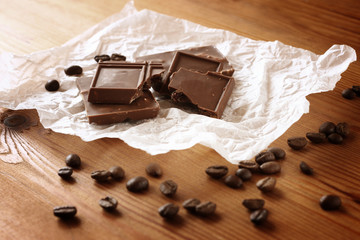 chocolate, cinamon and coffee beans on wooden table