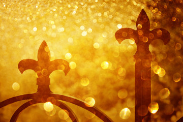 iron fence spears and glitter gold light burst