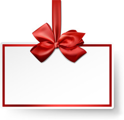 White paper gift card with red satin bow.