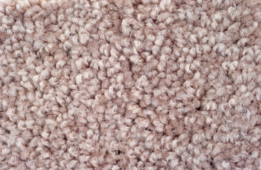 A very close view of rose plush carpeting