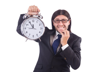 Young businessman with clock on white