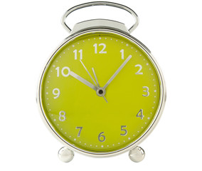 Green alarm clock on white background