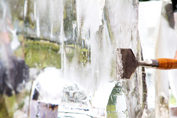 Ice Sculpting,Ice Carver Using Chisel to Carve