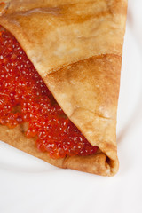 Pancake with red caviar