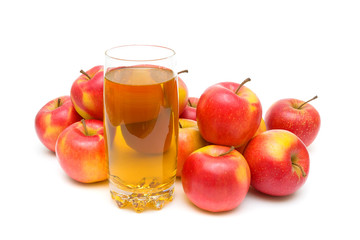 apple juice in glass and ripe apples on a white background