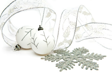 White New Year's balls and decorative tape on white background