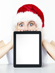 Voucher on tablet pc for christmas with surprised woman