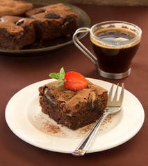 Chocolate brownie cake with strawberries.