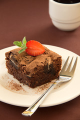 Fototapeta na wymiar Chocolate brownie cake with strawberries.