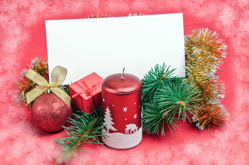 christmas decorations with card on red