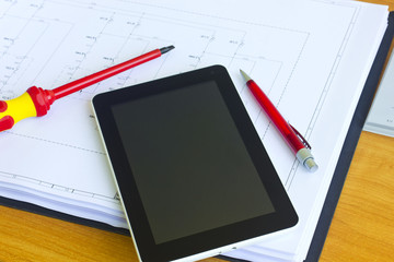 Tablet computer and tools over engineering diagram
