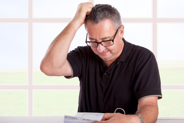 Man at desk with file folders