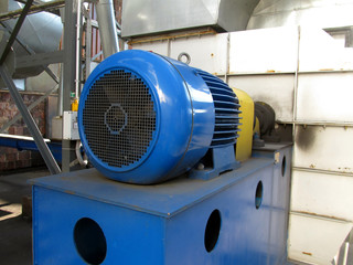 large electric motor of blue color as the drive to the  fan