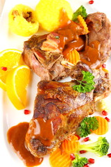Braised rabbit meat with potato dumplings and vegetables