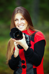 Beautiful woman with photo camera smiling
