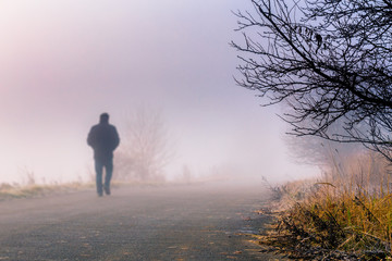 men silhouette in the fog