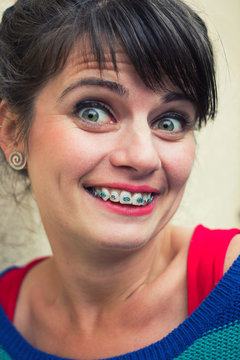 Surprised woman wearing braces