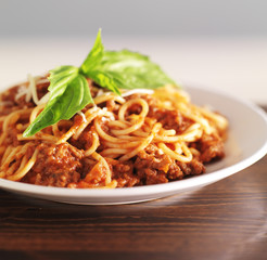 spaghetti dinner with meat sauce and basil