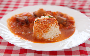 Stew with rice garnish