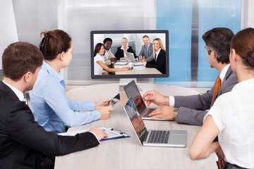 Businesspeople Looking At Computer Screen