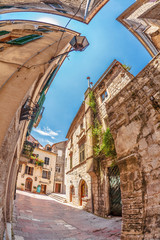 Fish-eye view of the old city on sky background