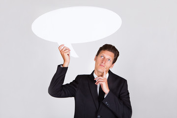 Businessman Holding Talking Bubble