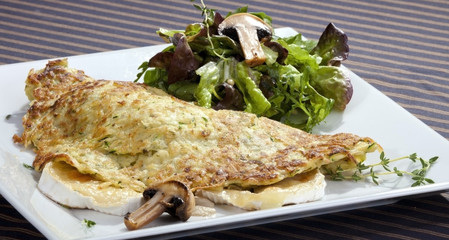 Potato pancake filled by camembert and mushrooms