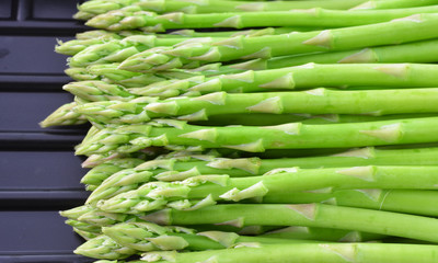 asparagus in black plastic container