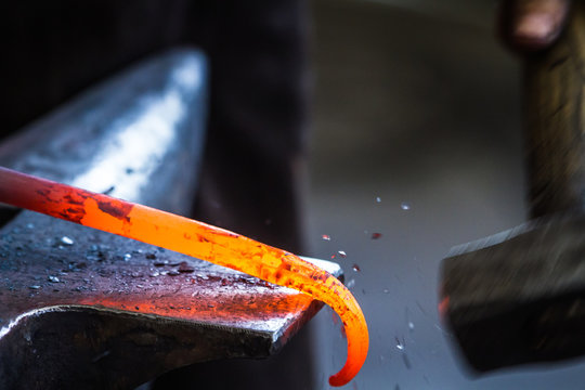 Blacksmith at work in anvil