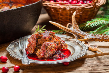 Venison with cranberry sauce in the forester