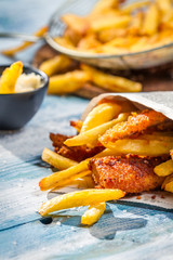 Closeup of Fish & Chips served in the newspaper