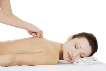 Fototapeta na wymiar Preaty woman relaxing being massaged in spa saloon.
