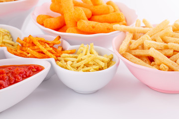 Potato, corn and wheat chips in bowls