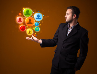 Social network icons in the hand of a businessman