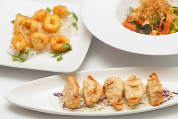 gyoza on a white dish.