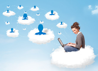 Young woman sitting in cloud with laptop