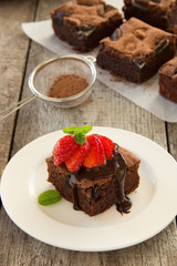 Chocolate brownie cake with strawberries.